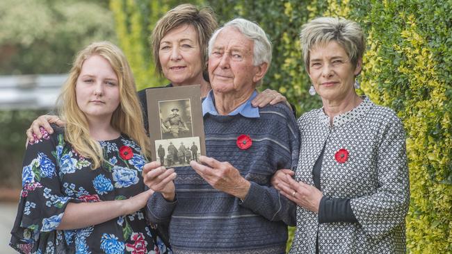 Kevin Lockett with daughters Vickie Grainger and Jennie Lockett and granddaughter Caitlin Grainger, with a photograph of Tom Lockett. Picture: Rob Leeson