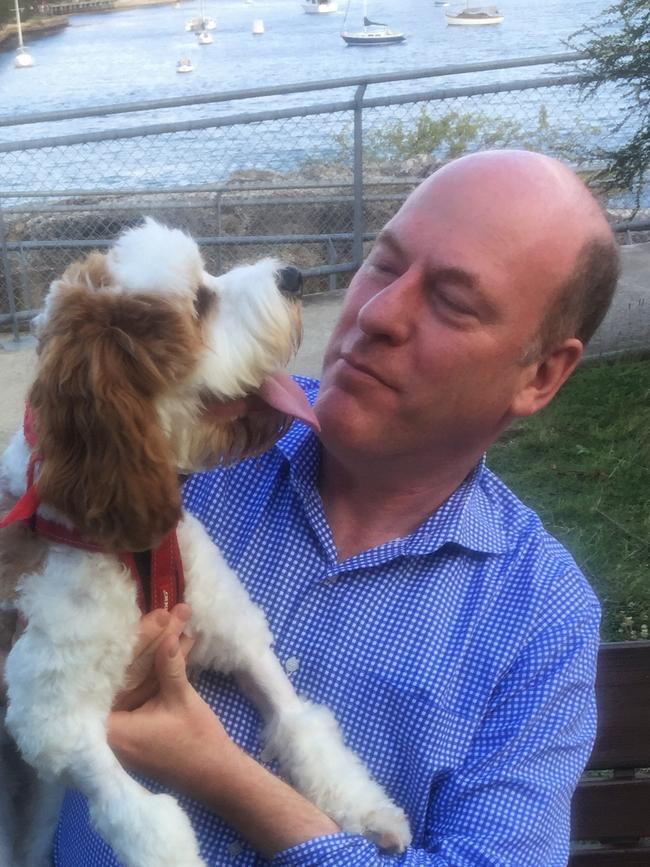 Trent Zimmerman with his dog Simba.