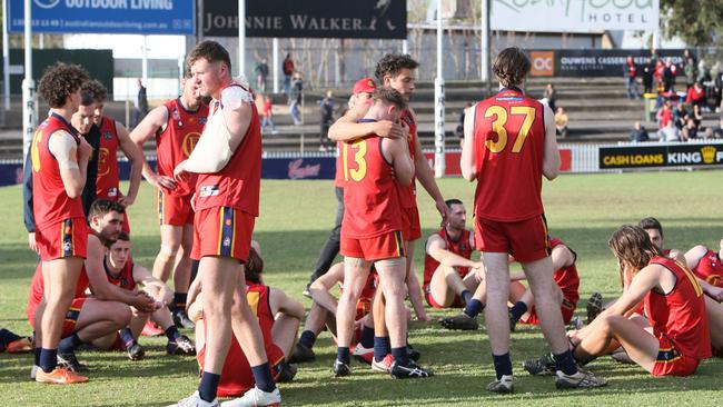 A dejected Flinders Park team after losing to Golden Grove in the 2020 Adelaide Footy League division three grand final at Norwood Oval. Picture: Emma Brasier