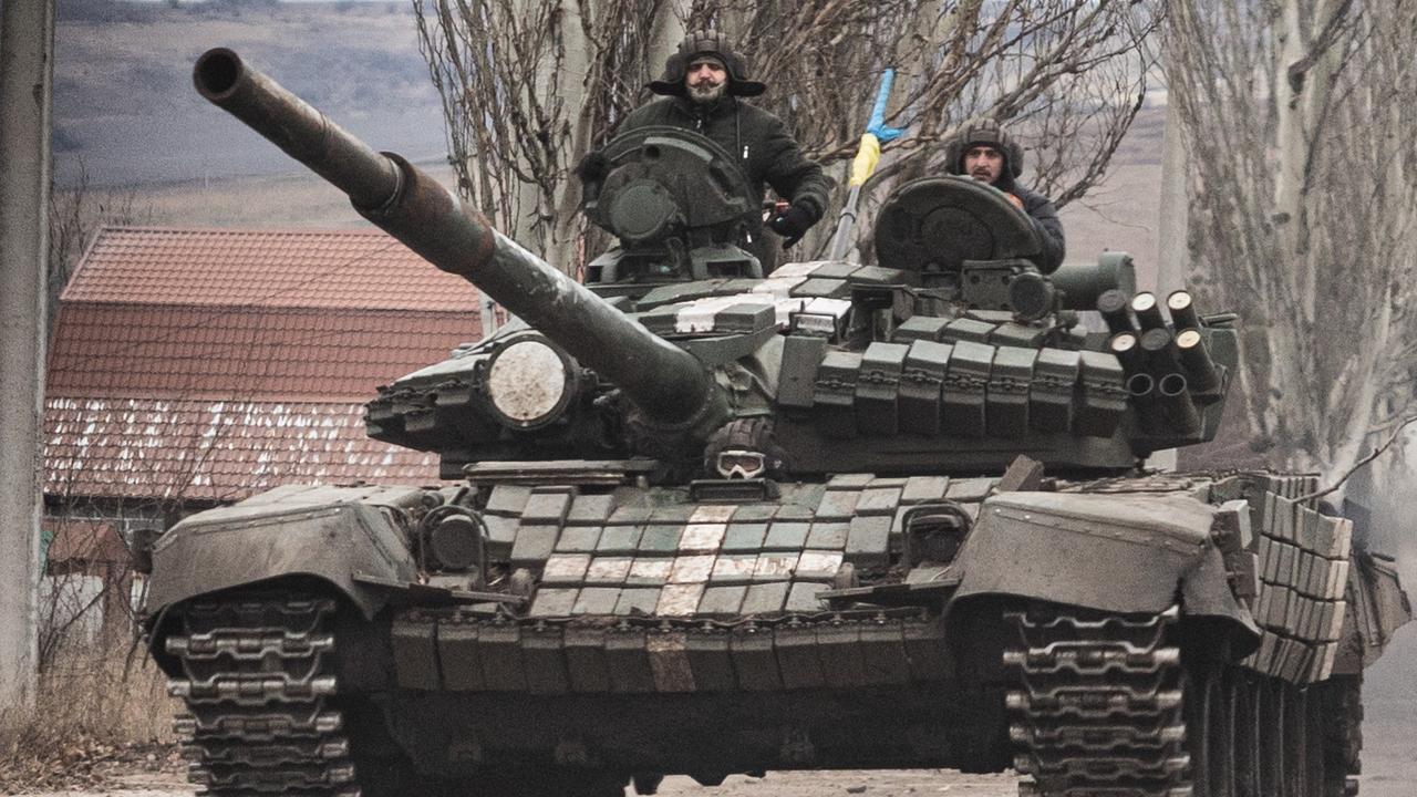 Ukrainian armed forces’ soldiers drive a T-72 tank on the outskirts of Bakhmut, eastern Ukraine on December 21. Picture: Sameer Al-Doumy/AFP