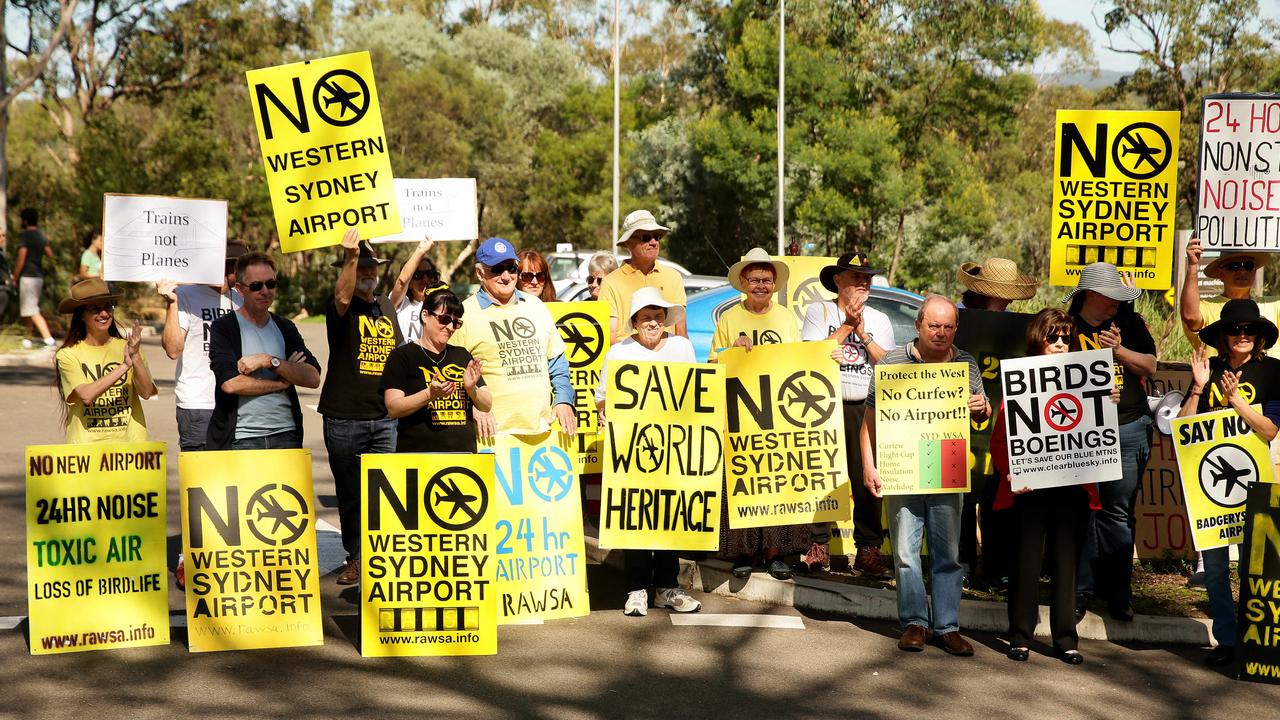 Members of the Residents Against Western Sydney Airport (RAWSA) action group converge on the gates to the Blue Mountains National Park to let tourists know their gripes