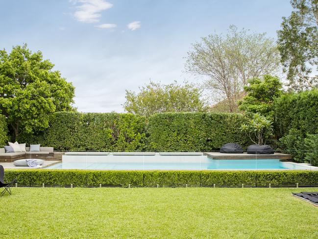 Home Gardening Budget gardening. Green lawn in a garden by Matt Leacy from Landart Landscapes.