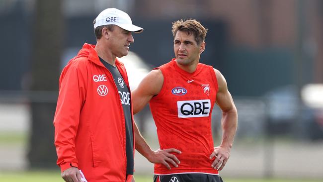 Swans coach John Longmire, pictured left with Josh Kennedy, has to solve his side’s slow-starting woes. Picture: Phil Hillyard