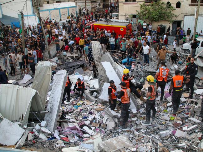 Residents search for victims in buildings destroyed during Israeli air raids in the southern Gaza Strip in Khan Yunis, Gaza. Picture: Getty Images