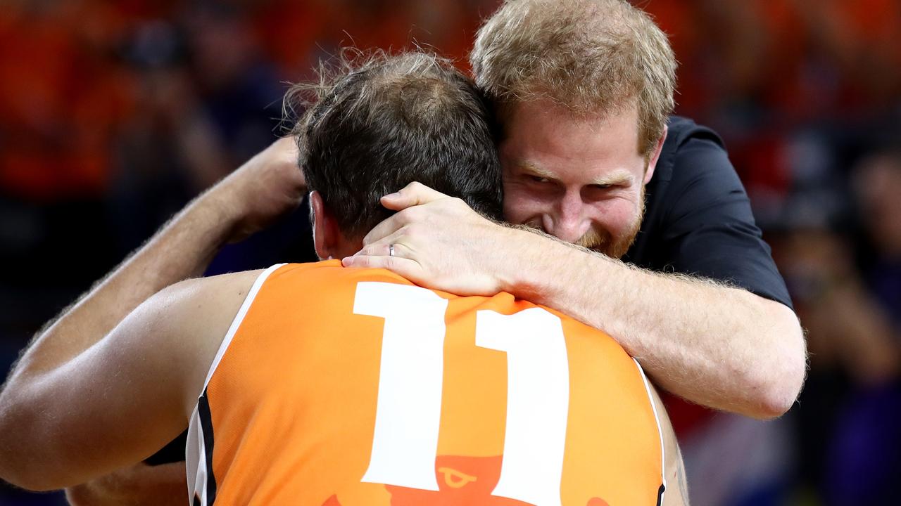 Prince Harry embraces Marc Van De Kuilen of the Netherlands following the gold medal match of the wheelchair basketball between the Netherlands and the United States. Picture: Cameron Spencer/Getty Images for the Invictus Games Foundation.