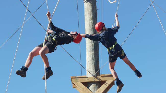 Zayd, 14 and Sam, 15 from Hallett Cove High School on the high ropes during Operation Flinders. Picture: Simon Cross