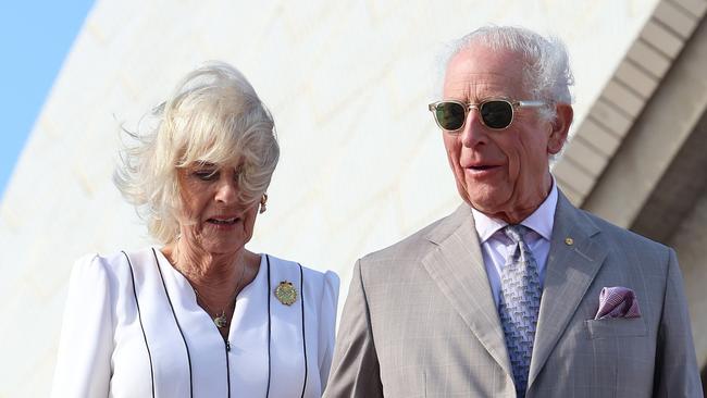 SYDNEY, AUSTRALIA - OCTOBER 22: King Charles III and Queen Camilla walk down the steps at the Sydney Opera House on October 22, 2024 in Sydney, Australia. The King's visit to Australia is his first as monarch, and the Commonwealth Heads of Government Meeting (CHOGM) in Samoa will be his first as head of the Commonwealth. (Photo by Chris Jackson/Getty Images)