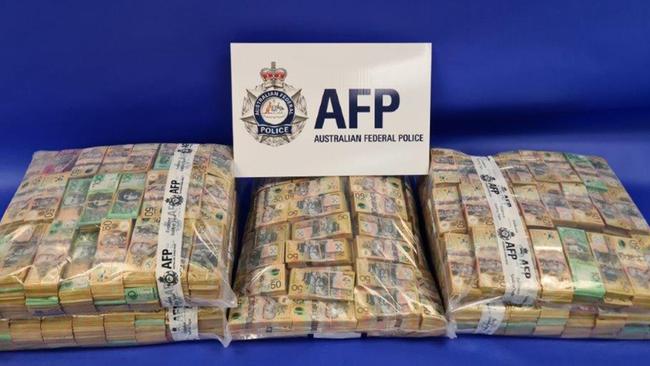 Bags of cash seized under the AFP-led Operation Ironside in SA. Picture: AFP