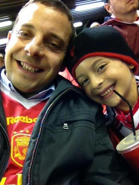 Henri with son Yonatan at a football game in September, 2014.