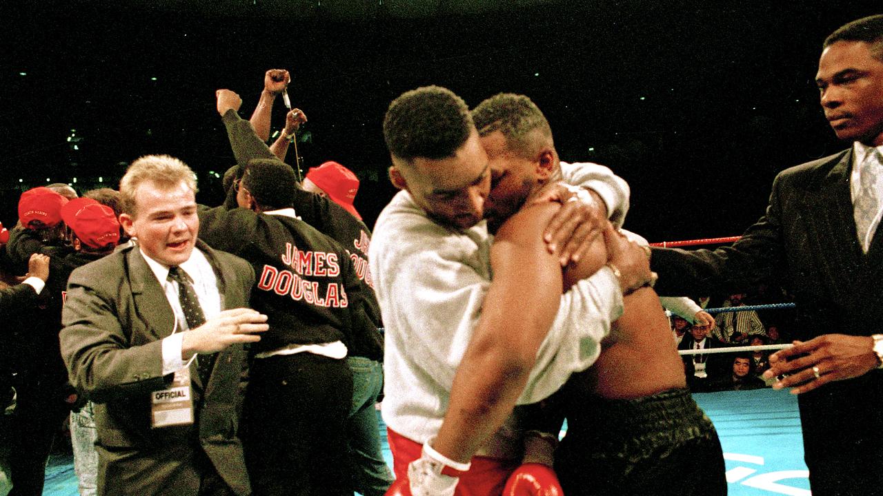 American boxers James 'Buster' Douglas (left) and Mike Tyson embrace after their world heavyweight title fight at the Tokyo Dome in Tokyo, Japan, 11th February 1990. Douglas won by a knockout in the 10th round in one of the biggest upsets in boxing history. (Photo by Michael Brennan/Getty Images)