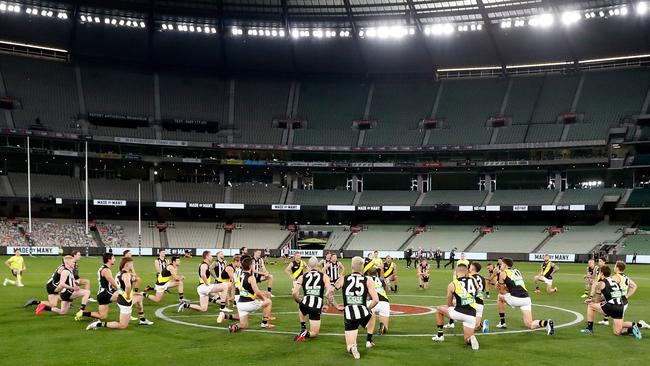 Players take a knee to support the Black Lives Matter movement at the MCG. Picture: Getty Images