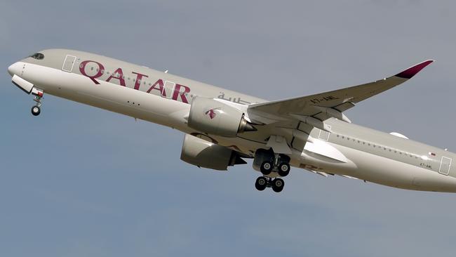 (FILES) This file photo taken on September 27, 2019 shows a Qatar Airways Airbus A350 aircraft taking off from Toulouse-Blagnac airport, near Toulouse. - Revelations that passengers flying through Doha were forced to endure vaginal inspections have upended Qatar's efforts to boost its reputation before the Gulf state hosts World Cup 2022, experts say. Officers marched women off a Sydney-bound Qatar Airways flight earlier this month and forced them to undergo intimate examinations after a newborn baby was found abandoned in an airport bathroom. (Photo by PASCAL PAVANI / AFP)