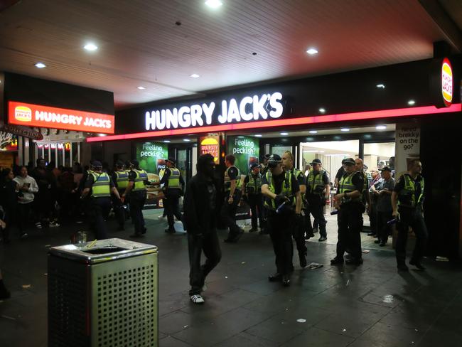 Police in Swanston St during the Moomba riots. Picture: Yuri Kouzmin