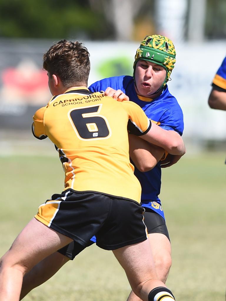 Boys Rugby League State Championship held at Northern Division, Brothers Leagues ground, Townsville. 14-15 years. Capricornia (gold) v South West (blue). Sam Jenkins of St John's School, Roma.