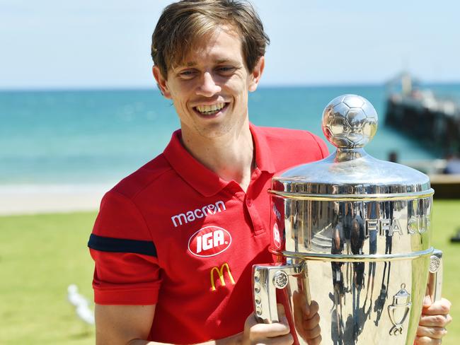Craig Goodwin of United is seen with the  FFA Cup Trophy after a recovery session at Henley Beach, Adelaide. Wednesday, October 31, 2018. (AAP Image/David Mariuz) NO ARCHIVING