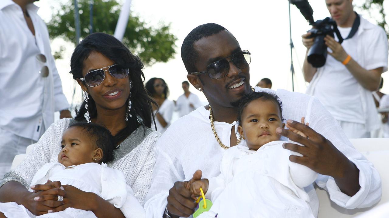 Diddy with his late partner Kim Porter with their twin daughters at a 2007 party. Picture: Getty Images for CP