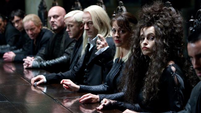 Helena Bonham Carter, Helen McCrory, Jason Isaacs and Tom Felton in a scene from film Harry Potter and the Deathly Hallows - Part 1.