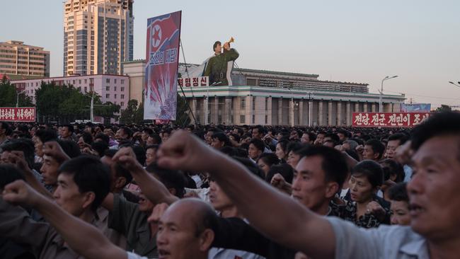 Participants of a mass rally against the US shout slogans as they gather on Kim Il-Sung square in Pyongyang. Picture: AFP