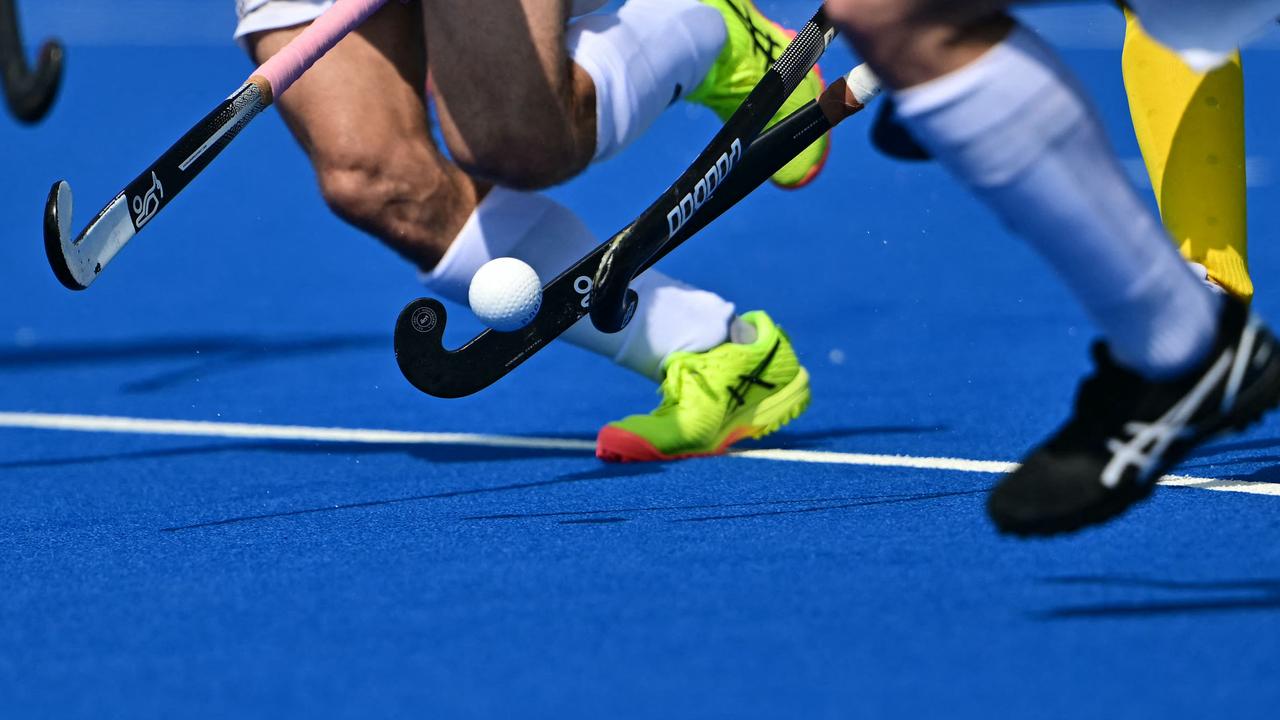 Players fight for the ball in the men's pool B field hockey match between New Zealand and Australia. Picture: Miguel Medina/AFP