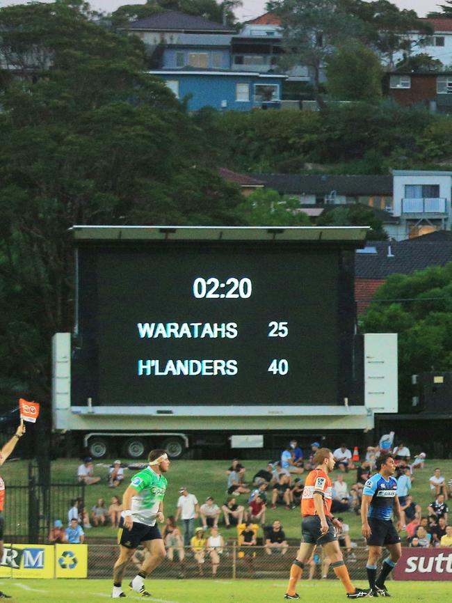 The old broken down scoreboard, right, with temporary scoreboard, left, during the Waratahs v Highlanders trial match at Brookvale Oval. Picture Mark Evans