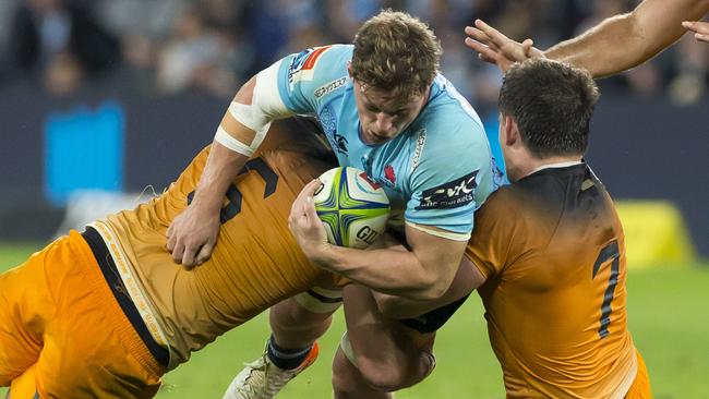 Waratahs captain Michael Hooper can’t breach the Jaguares defence on Saturday night. Picture: AAP