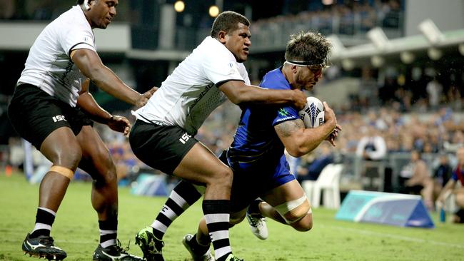 Western Force’s Brynard Stander barges his way past a pair of Fiji Warrioes defenders to score at NIB Stadium on Friday night. Picture: AAP