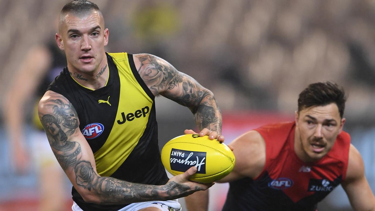 Dustin Martin of the Tigers (left) and Michael Hibberd of the Demons contest during the Round 20 AFL match between the Melbourne Demons and the Richmond Tigers at the MCG in Melbourne, Saturday, August 3, 2019.  (AAP Image/Julian Smith) NO ARCHIVING, EDITORIAL USE ONLY