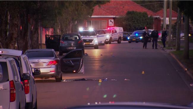 Detectives comb Mayvic St in Greenacre, the scene of the shootings. Picture: 9News