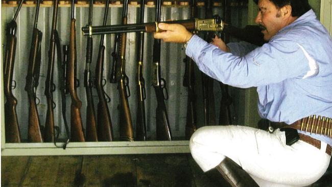 Charles Bisucci was prohibited from owning guns, but photos tendered to the Coroner's Court showed him with his secret stash after friends registered firearms for him in their names.