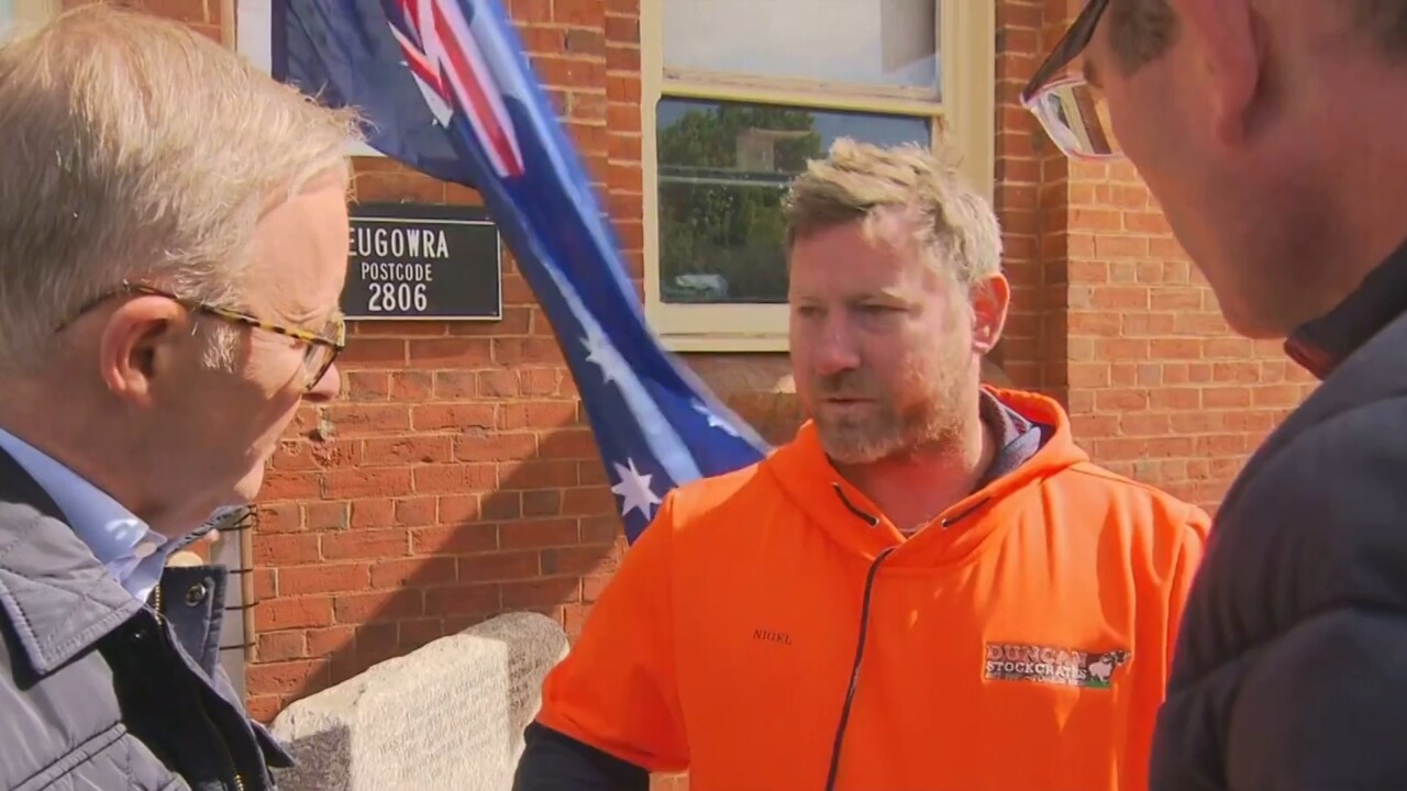 Albanese confronted by outraged local in flood-affected town