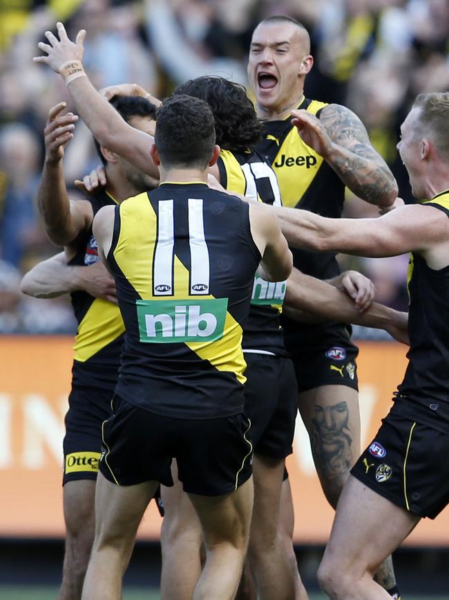 Tigers swamp Marlion Pickett after his first career goal. Picture: David Caird