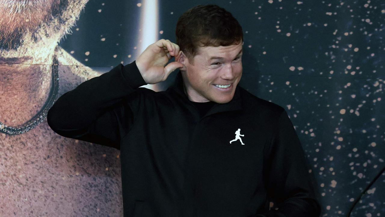 Mexican boxer Saul "Canelo" Alvarez gestures during a press conference to present his fight against British boxer John Ryder (out of frame) on May 6, in Guadalajara, Jalisco state, Mexico, on May 3, 2023. (Photo by ULISES RUIZ / AFP)