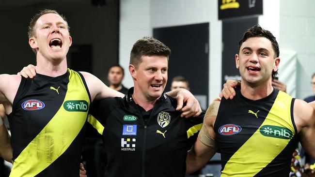 Andrew McQualter sings the song with his players after his first win as Richmond coach. Picture: Getty Images