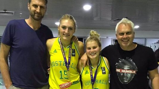 Boomers legends Chris Anstey and Shane Heal with Aussie Gem daughters Izzy and Shyla, in Bangkok for U19 championships