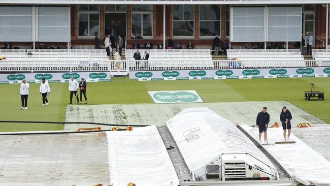 The umpires com out from the pavilion to inspect the pitch. Picture: AP