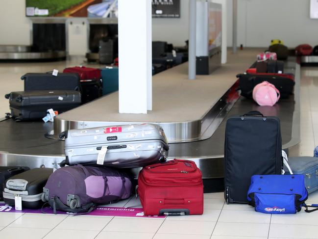 ADELAIDE, AUSTRALIA - NewsWire Photos July 28: Passengers of the last morning flight from Melbourne arrive at Adelaide Airport. South Australia will be closing its boarders to all travellers from Midnight tonight. Picture: NCA NewsWire / Kelly Barnes