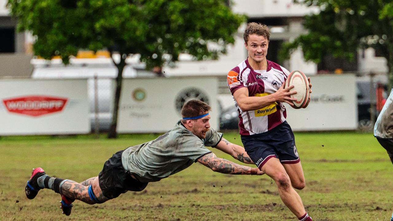 Jordan Mayhew in action for the Noosa Dolphins as he gets past a Maroochydore Swans player. Picture: Rachel Wright Images