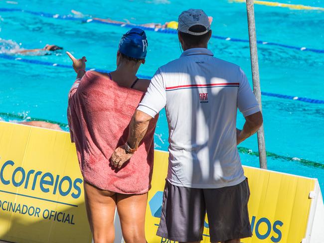 Scott Volker with a female swimmer at the Brazilian Junior Swimming Championships. Picture: Ariel Guevara.