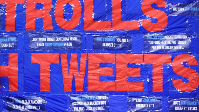 Some of the shocking tweets displayed on the Demons’ banner. Picture: Getty Images