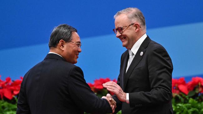 China’s Premier Li Qiang and Prime Minister Anthony Albanese exchange greetings at the CIIE in 2023. Picture: AFP