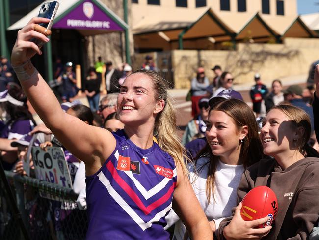 Fremantle’s after-the-siren hero Aisling McCarthy takes a selfie with fans. Picture: Will Russell/AFL Photos via Getty Images