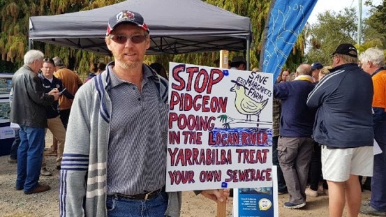 Leeroy Bobermein with his placard at a community consultation meeting where residents voiced scepticism about claims no site had been chosen.