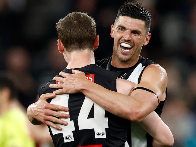 MELBOURNE, AUSTRALIA - AUGUST 17: Ned Long (left) and Scott Pendlebury of the Magpies celebrate during the 2024 AFL Round 23 match between the Collingwood Magpies and the Brisbane Lions at The Melbourne Cricket Ground on August 17, 2024 in Melbourne, Australia. (Photo by Michael Willson/AFL Photos via Getty Images)