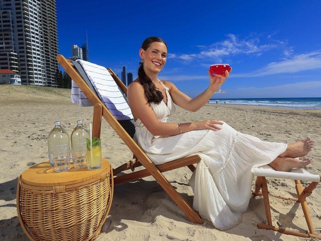 **HOLD FOR FUTURE BRISBANE: DAY 1 FRONT PAGE**Jessica Sims with Yuri Ketsuriyong (waitress) enjoys the beachfront at the Langham on the Gold Coast. Pics Adam HeadStory: Mediterranean-style beach clubs could become permanent summer fixtures on Queensland famous beaches. While overwater helipads and more water taxi-style services on the Brisbane River could unlock faster commuter travel to popular precincts and the Moreton Bay Islands, as city leaders work to unlock the potential of the southeastÃs signature waterfronts for the betterment of both tourists and locals.