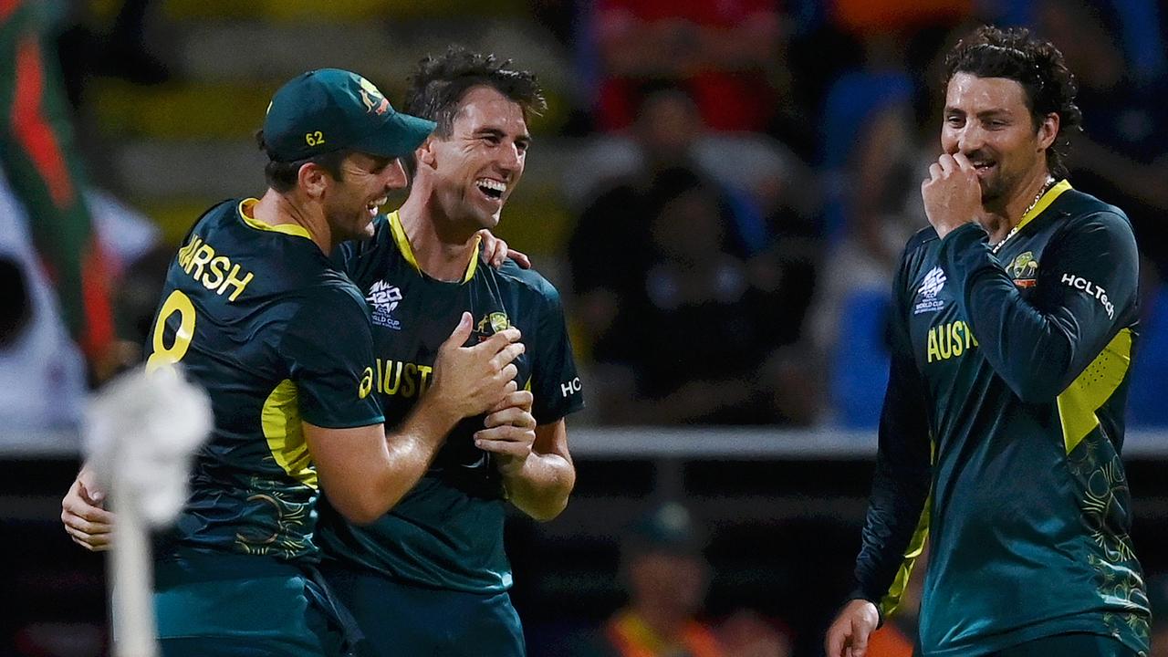 Pat Cummins of Australia celebrates with teammates. Photo by Gareth Copley/Getty Images