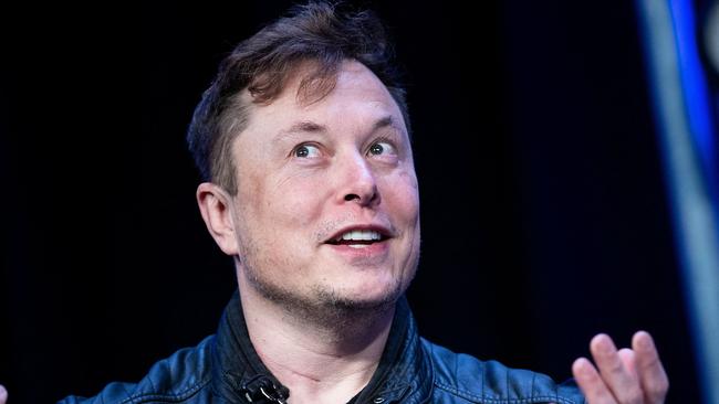 (FILES) In this file photo taken on April 11, 2022, Elon Musk, founder of SpaceX, speaks during the Satellite 2020 at the Washington Convention Center in Washington, DC. - Elon Musk said on May 13, 2022  he was putting a temporary halt on his much-anticipated deal to buy Twitter, sending shares in the social media giant plunging. (Photo by Brendan Smialowski / AFP)