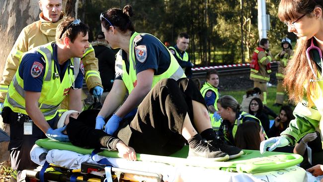 A passenger is placed on a stretcher. Picture: Nicole Garmston