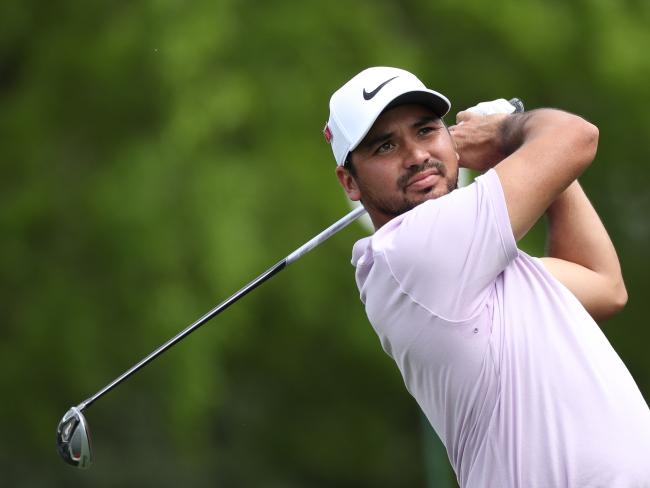 Jason Day overcame a back injury to set the pace on a wild day at Augusta. Picture: Getty