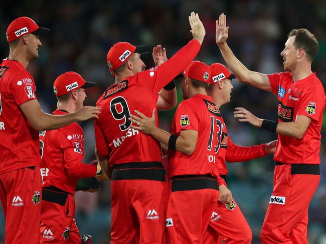 The Melbourne Renegades celebrate another wicket on their way to their first win of the competition.