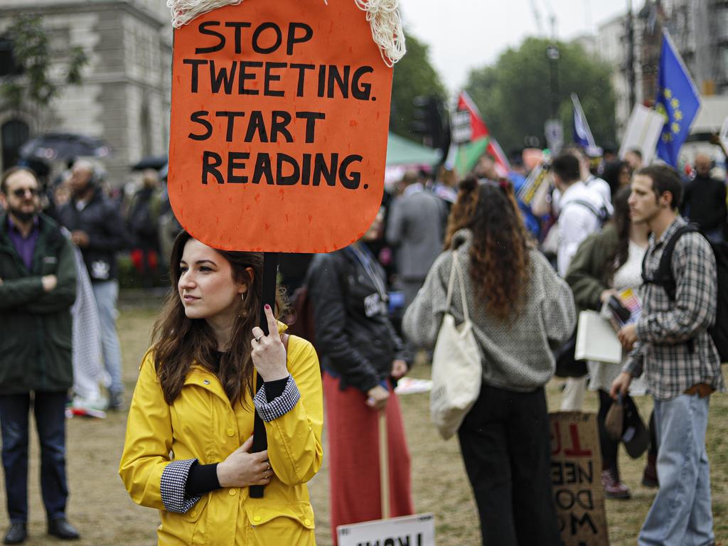 Protesters travelled from across the UK on a Tuesday with placards bearing anti-Trump messages in central London. Picture: AP Photo/Matt Dunham